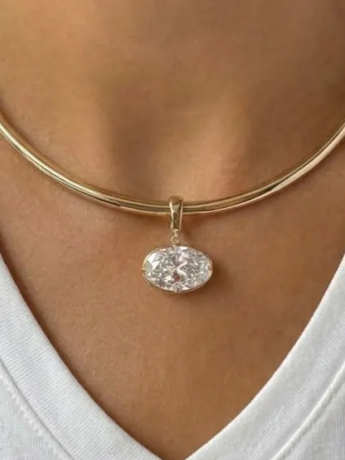 An oval, hung from a gold collar